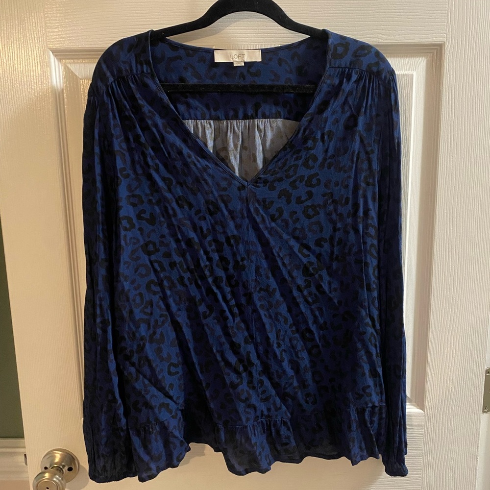 Blue and black animal print ruffle top